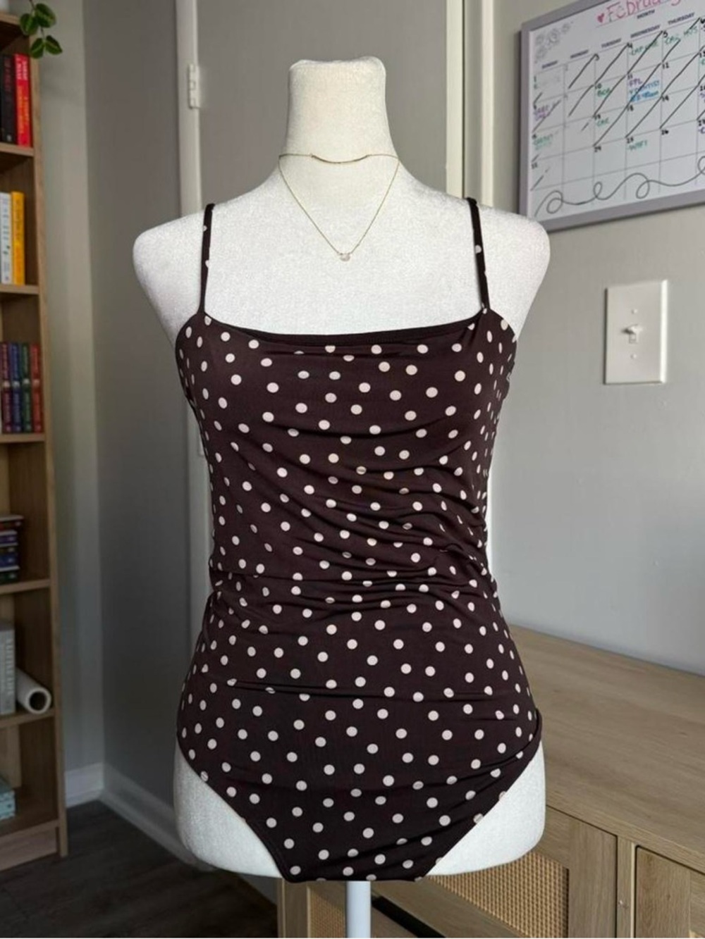 brown and white polka dot bodysuit